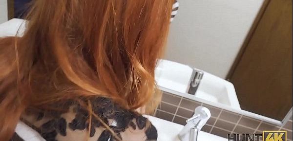 HUNT4K. Hunter fucks gorgeous redhead in the public restroom